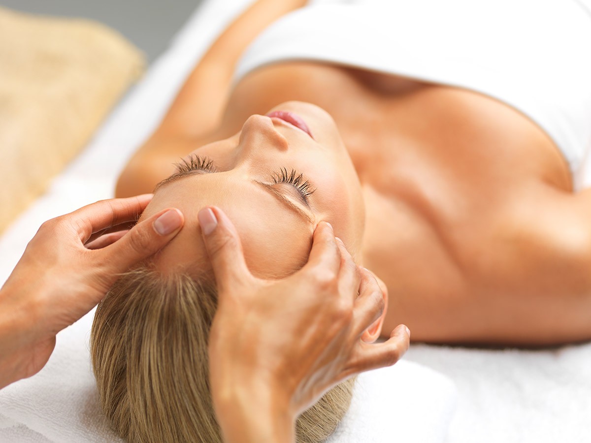 A beautiful young woman relaxing in a spa